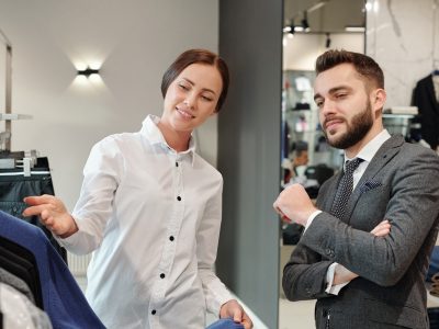 Clothing store consultant working with client Clothing store consultant working with client